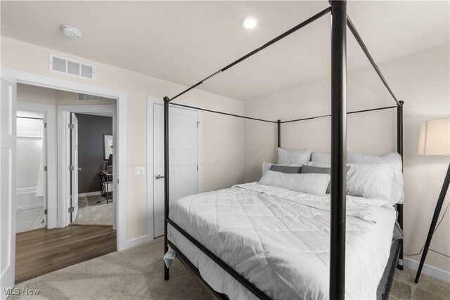 bedroom with hardwood / wood-style floors