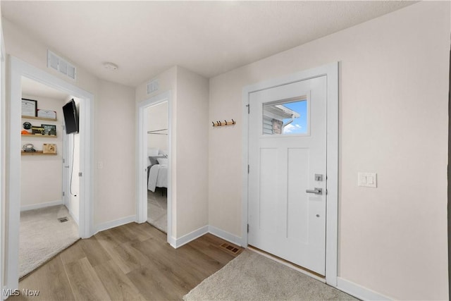 foyer with light wood-type flooring