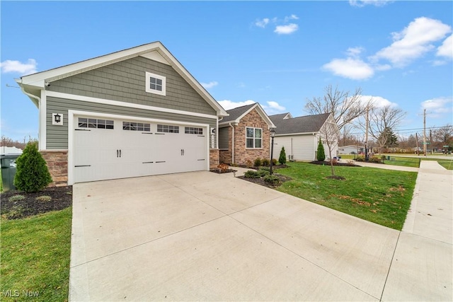 craftsman-style home featuring a garage and a front lawn