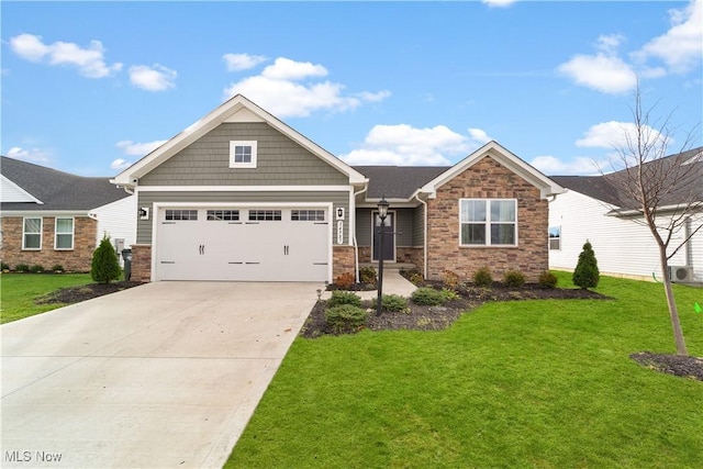 craftsman inspired home with a garage and a front yard