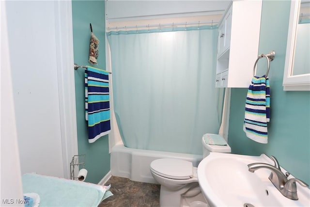 full bathroom with sink, shower / bath combination with curtain, and toilet