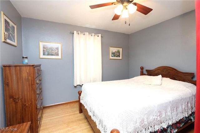 bedroom featuring light wood-type flooring and ceiling fan