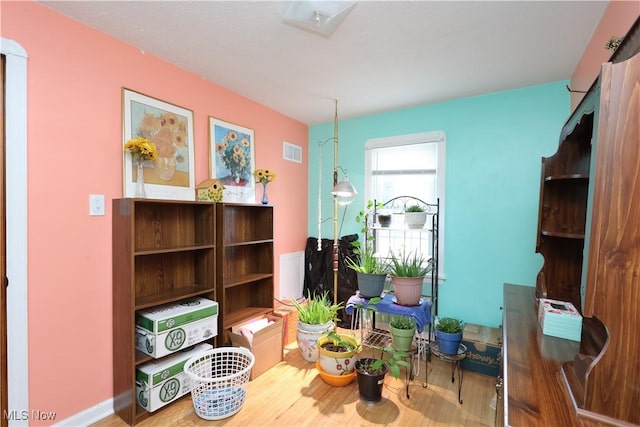 miscellaneous room featuring hardwood / wood-style flooring