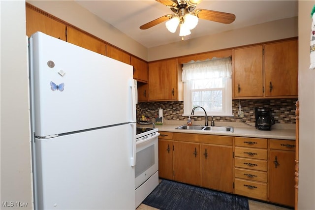 kitchen with decorative backsplash, sink, ceiling fan, and white appliances