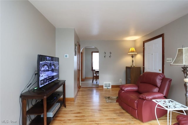 living room with light hardwood / wood-style floors