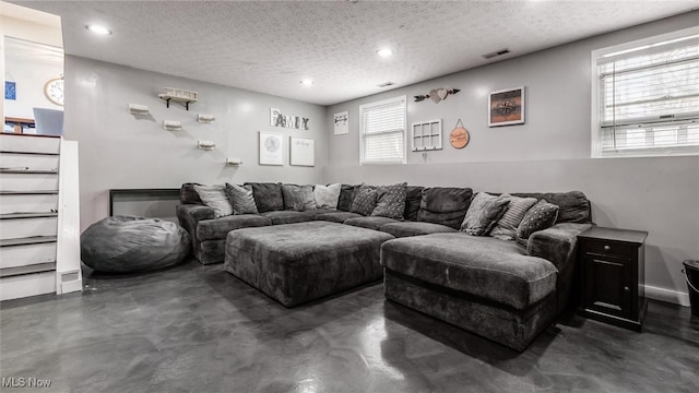 living room featuring a textured ceiling