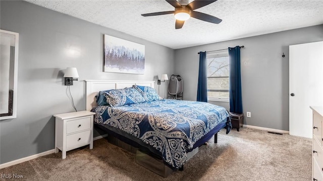 bedroom with carpet flooring, ceiling fan, and a textured ceiling