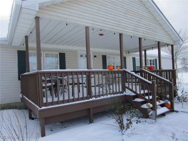 view of snow covered deck