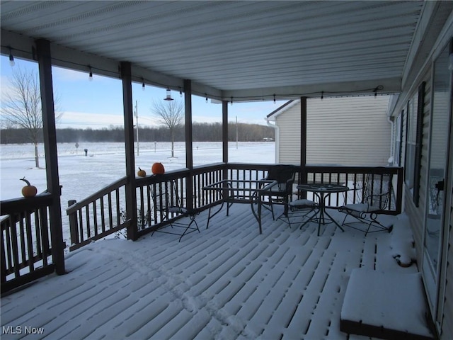 view of snow covered deck