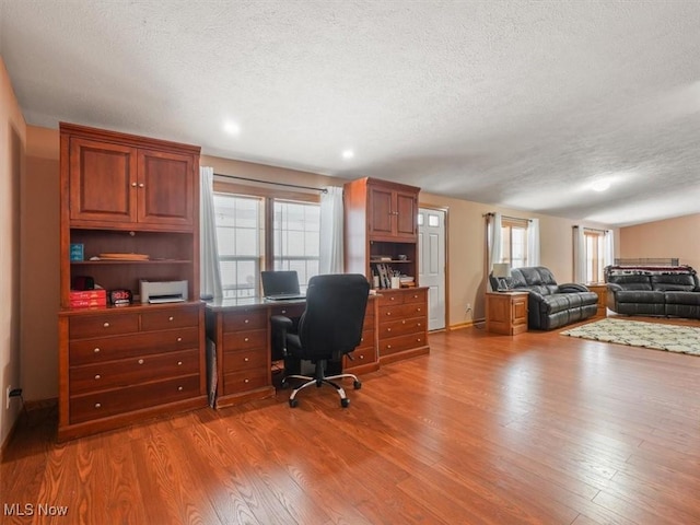 office featuring hardwood / wood-style floors and a textured ceiling