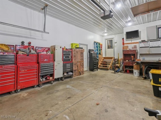 garage featuring a workshop area and a garage door opener