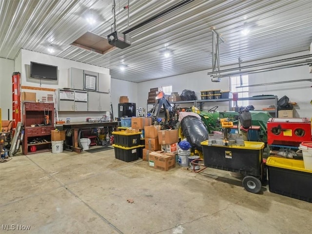 garage featuring a workshop area and a garage door opener