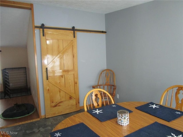 dining space with a barn door