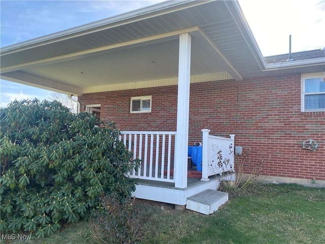 view of side of home with covered porch