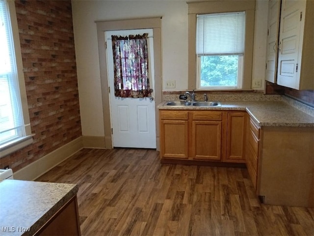 kitchen with sink and dark wood-type flooring