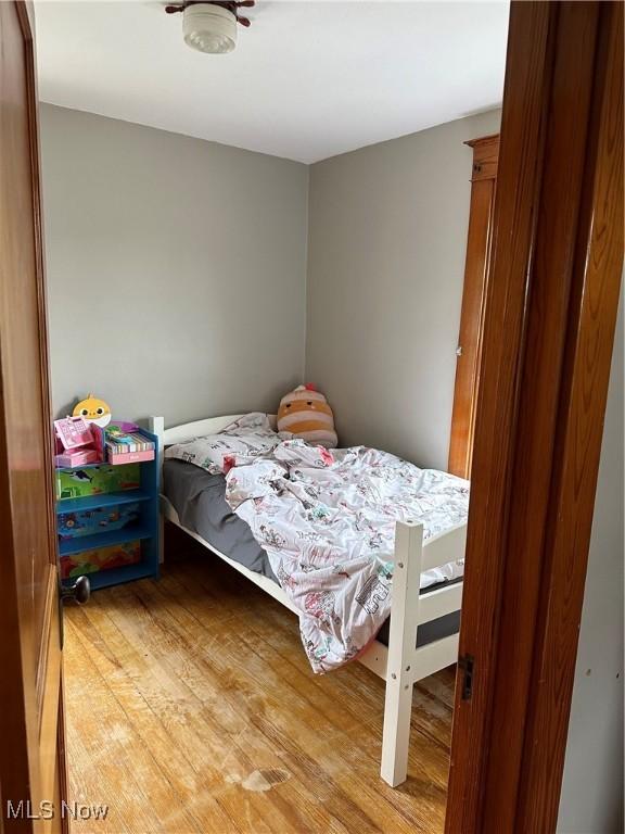 bedroom with hardwood / wood-style floors