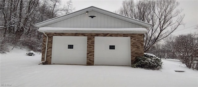 view of snow covered garage