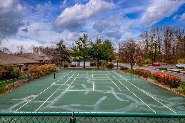 view of property's community with tennis court