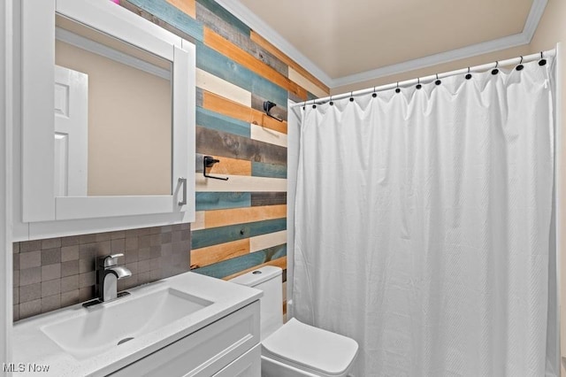 bathroom with vanity, tasteful backsplash, toilet, and ornamental molding