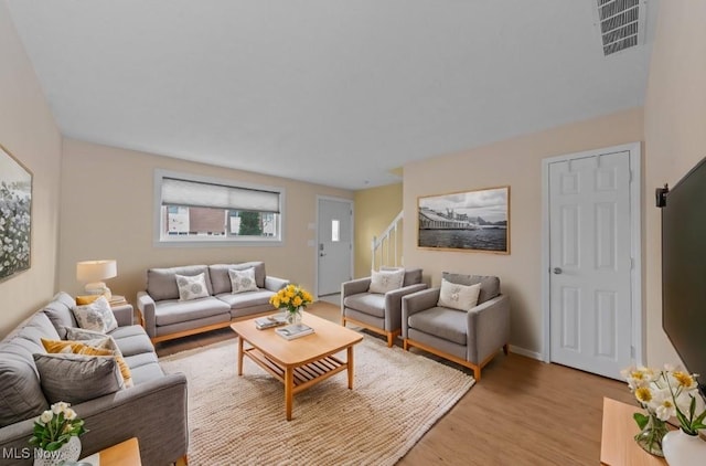 living room with light hardwood / wood-style floors