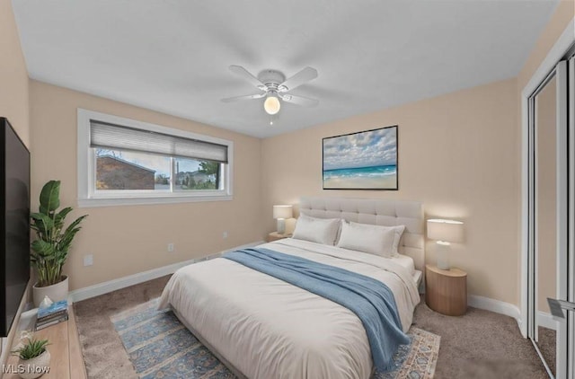 bedroom featuring a closet, ceiling fan, and light colored carpet