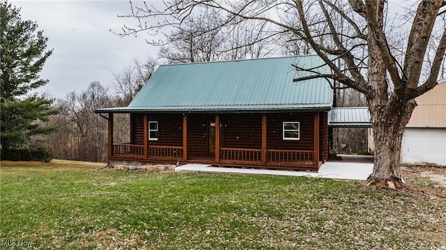 exterior space featuring a porch and a yard