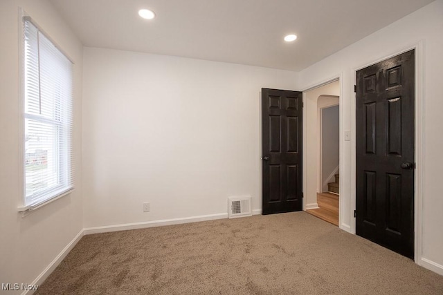 unfurnished bedroom featuring carpet