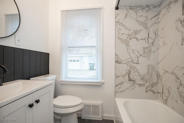 full bathroom with vanity, toilet, and tiled shower / bath