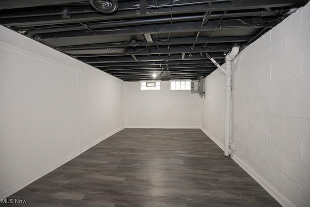 basement featuring dark hardwood / wood-style floors