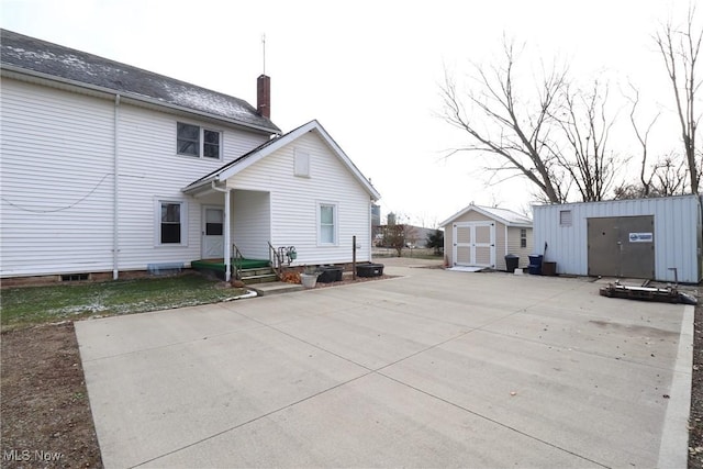 rear view of house with a shed