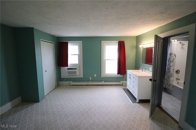 bathroom with vanity, a baseboard heating unit, shower / bath combination with curtain, cooling unit, and a textured ceiling