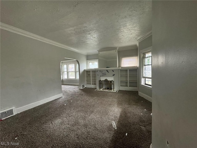 unfurnished living room with carpet flooring and ornamental molding