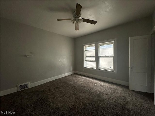 unfurnished room with carpet flooring and ceiling fan