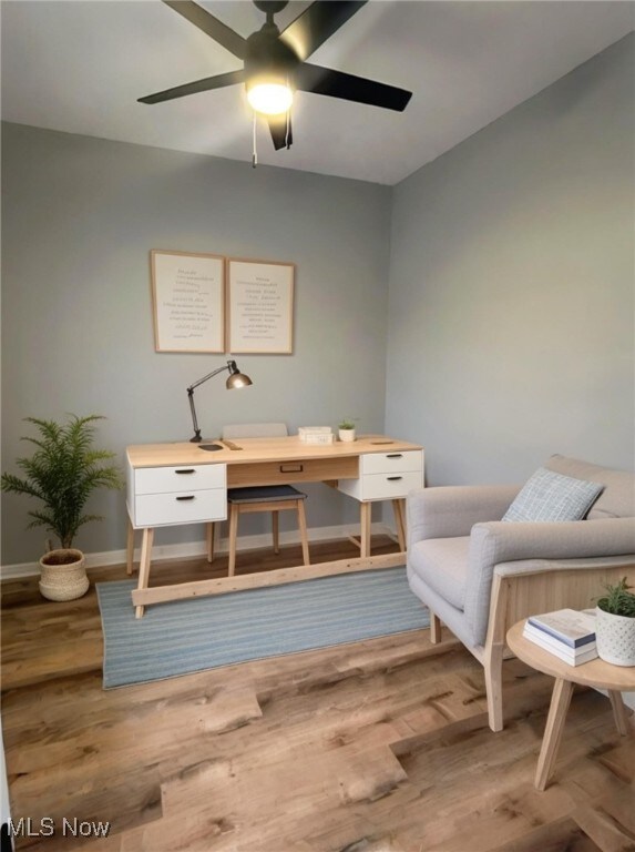 office area with hardwood / wood-style flooring and ceiling fan