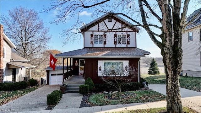 tudor-style house with covered porch and a front lawn