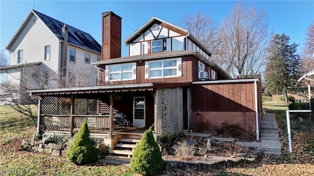 rear view of house with a porch