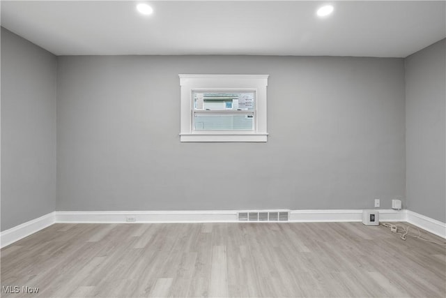 unfurnished room featuring light hardwood / wood-style floors