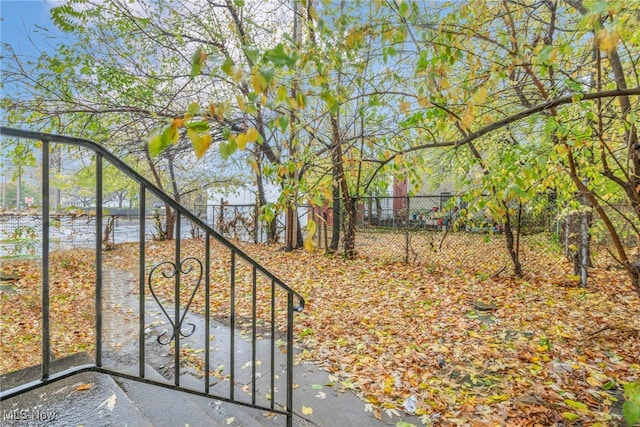 view of gate with a water view