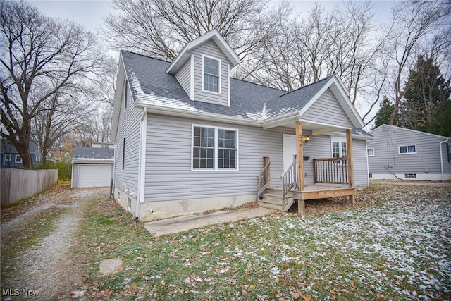 view of front of house with an outbuilding and a garage