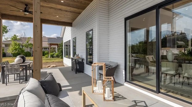 view of patio featuring ceiling fan and an outdoor living space