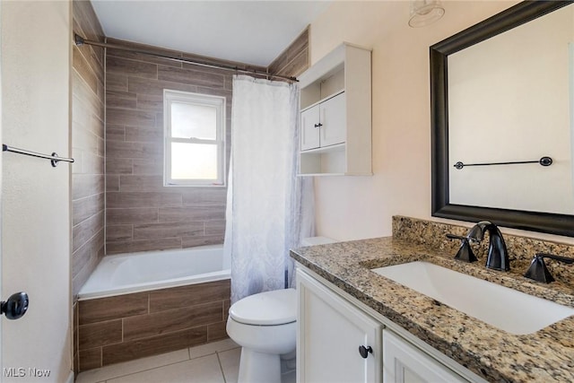 full bathroom featuring toilet, vanity, tile patterned floors, and shower / bath combo with shower curtain