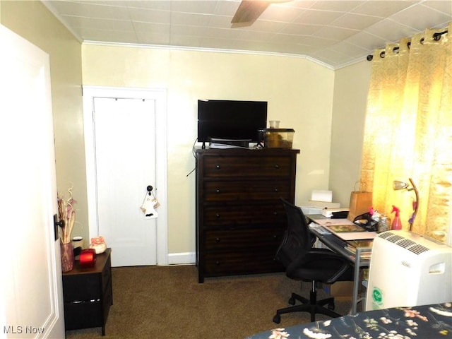 home office with dark colored carpet, ornamental molding, and vaulted ceiling