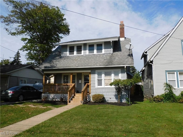 bungalow featuring a front yard and a porch