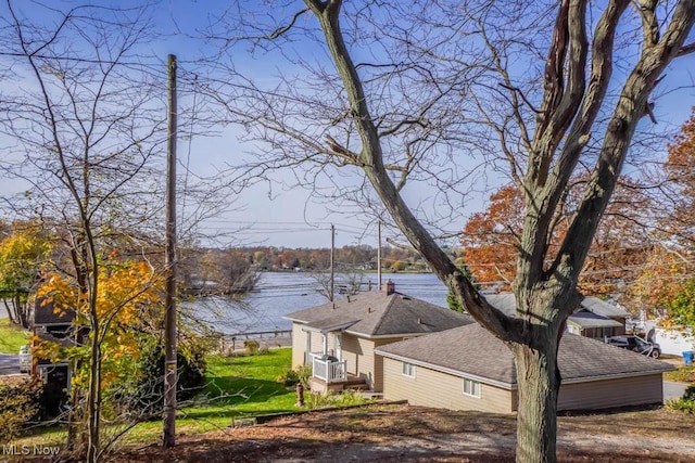 view of side of property with a water view