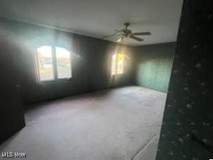 unfurnished room featuring ceiling fan