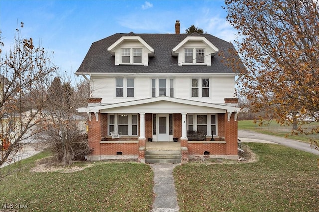 view of front of home featuring a front lawn and a porch