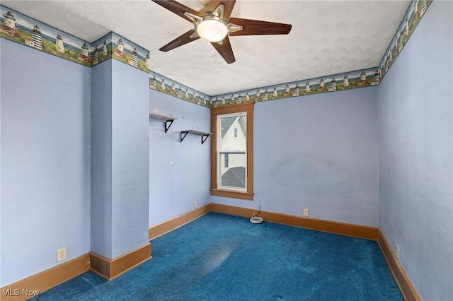 carpeted empty room featuring ceiling fan