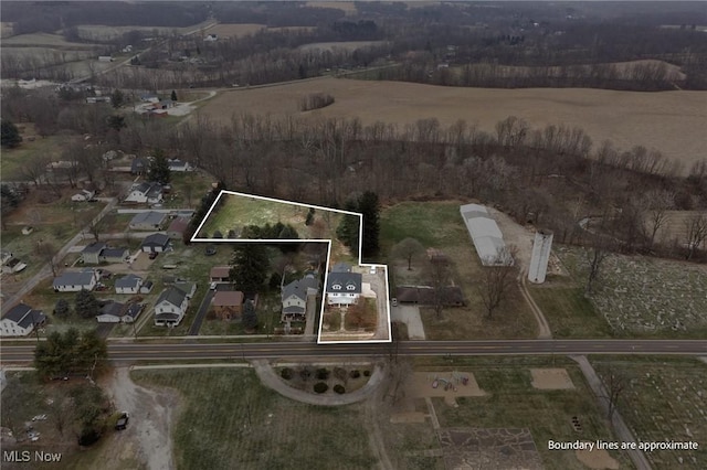 birds eye view of property featuring a rural view