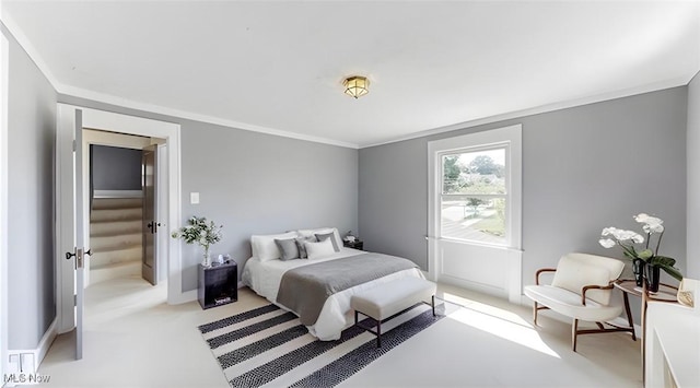 carpeted bedroom with crown molding