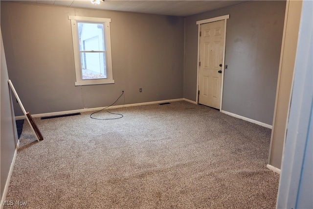 spare room featuring carpet flooring